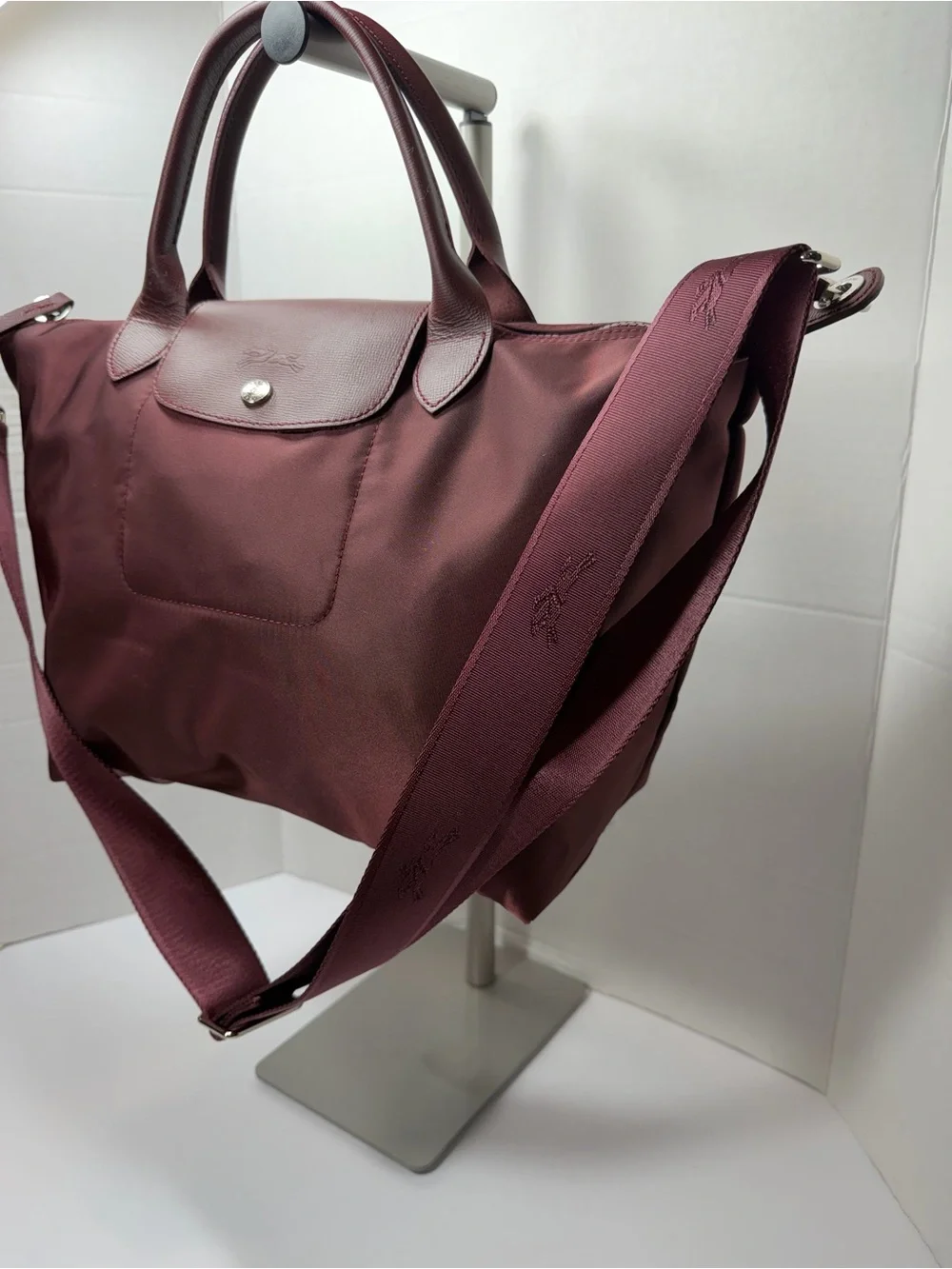 LONGCHAMP Burgundy medium Le Pliage tote from LONGCHAMP featuring leather trim